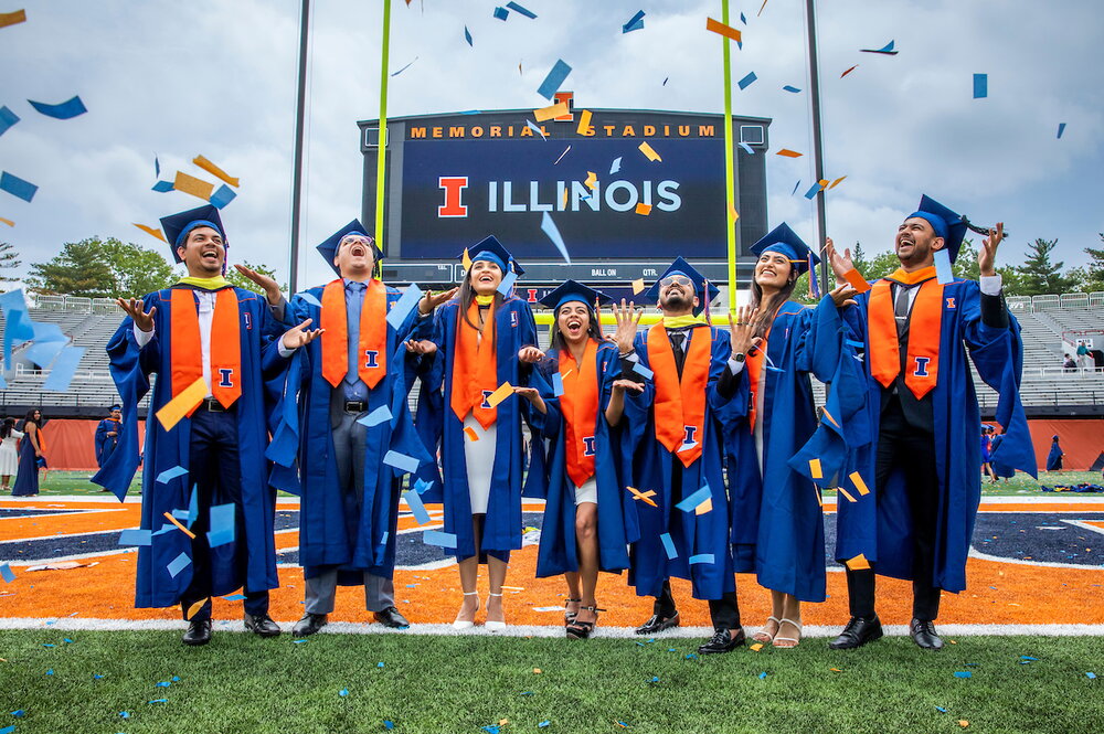 Students celebrate their accomplishments as graduates with confetti at the University of Illinois Urbana-Champaign Commencement Ceremony at Memorial Stadium on May 13, 2023.